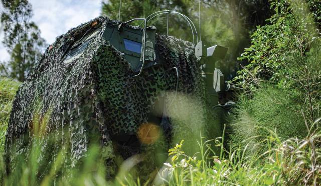 A Marine Corps High Mobility Artillery Rocket System concealed in a low-signature hide position within the Central Training Area in Okinawa, Japan. Concealment and camouflage are vital to protecting high-value assets such as antiship missile launchers, but they are insufficient.