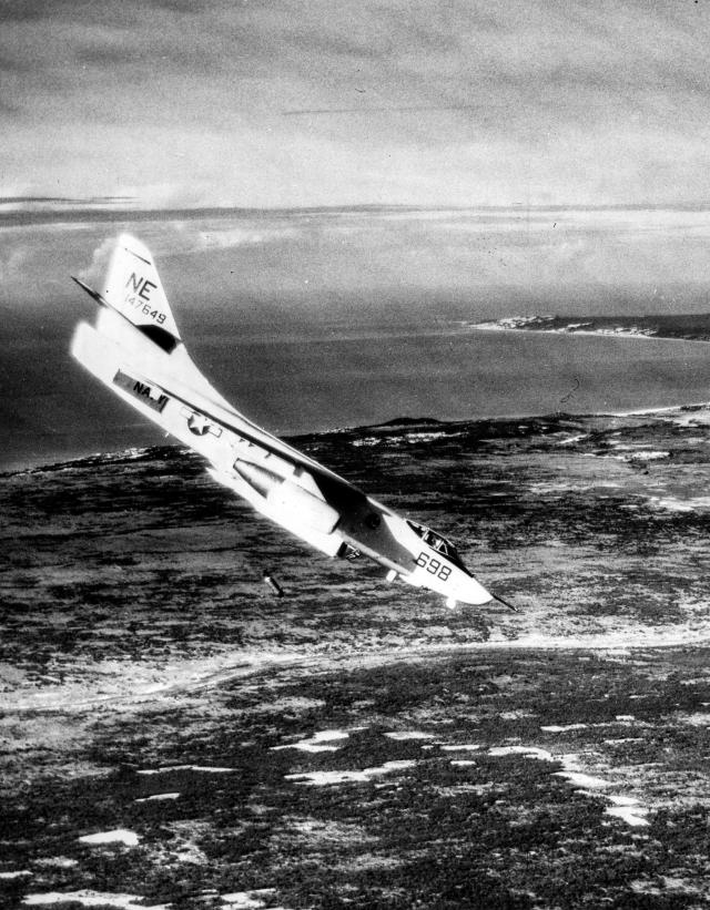 An A-3B Skywarrior releases a 500-pound bomb on a Viet Cong position in South Vietnam.