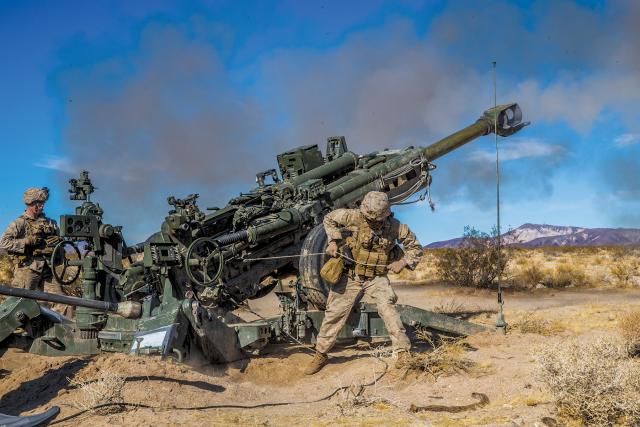 An artillery battery from 3rd Battalion, 11th Marines, 1st Marine Division, fires an M777 Howitzer during December’s Exercise Steel Knight. The West Coast combined-arms live-fire and maneuver exercise, led by the 1st Marine Division, included elements of the 3d Marine Air Wing, 1st Marine Logistic Group, I Marine Information Group, and I Marine Expeditionary Force.