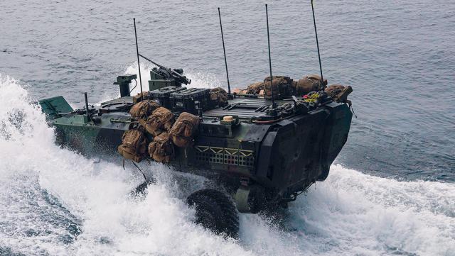 A Marine Corps amphibious combat vehicle launches from the well deck of the USS Harpers Ferry (LSD-49) while underway in the Pacific Ocean. Marine Corps littoral intelligence officers would specialize in amphibious operations, maritime sensing, and asymmetric maritime threats, complementing rather than duplicating the expertise of Navy intelligence officers.