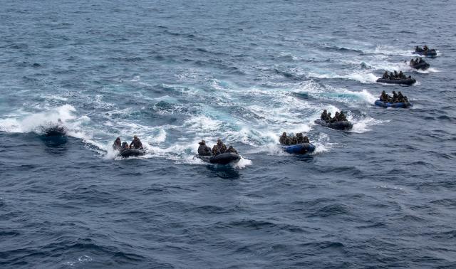 U.S. Marines practice a small-boat raid with the Amphibious Rapid Deployment Brigade, Japan Ground Self-Defense Force.