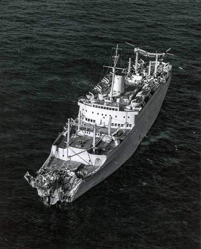 Aerial port bow view of an AIr Force helicopter removing injured form the "Stockholm"