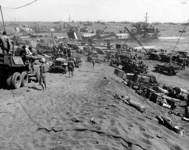 Later in the battle, Iwo's beach is crowded with ships, supplies and vehicles.