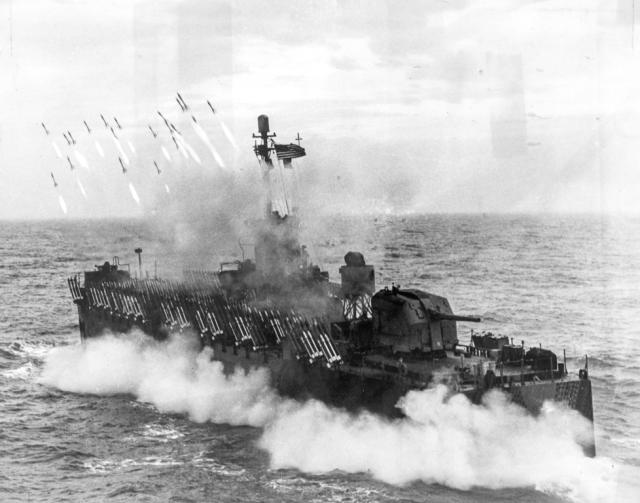 LSM(R) firing rockets onto a shore position during World War II