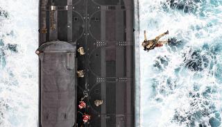 East Coast–based Navy SEALs participate in a special operations interoperability exercise with the guided-missile submarine USS Florida (SSGN-728) and a U.S. Air Force CV-22 Osprey.