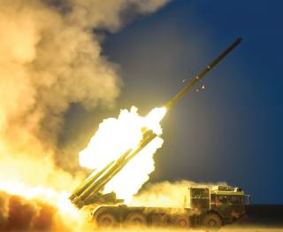 Chinese rocket and missile attacks included short-, medium-, and long-range barrages against targets on Taiwan, Japan, and Guam. Here, a PHL-03 multilaunch rocket system fires across the Taiwan Strait.