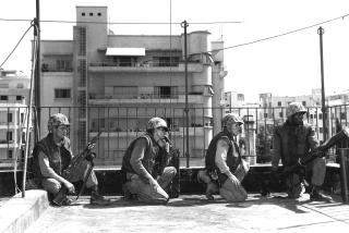 The Marines’ first foray into the ancient animosities of Lebanon came in 1958 in response to the tense Cold War considerations faced by the Eisenhower administration. Here, men of the 2d Battalion, 2d Marines take up position on the rooftop of the U.S. Ambassador’s residence in Beirut.