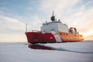 The USCGC Healy (WAGB-20) steaming through Arctic ice. The Coast Guard is the primary U.S. presence in the Arctic, and an ice-strengthened NSC(X) with robust communications and aviation facilities would be a force multipler given the region’s growing importance.