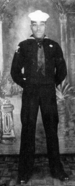 Portrait of Joe Small, standing