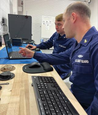 A Coast Guard electrician’s mate is trained to use computer-aided drawing software at the additive manufacturing shop at Industrial Production Facility New Orleans.
