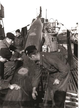 A group of men on a ship.