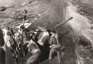 A group of men on a ship.
