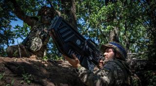 Soldiers from the 110th Territorial Defense  Brigade demonstrate an antidrone rifle in  Novodarivka, Zaporizhia Oblast. In any future fight, a contested airspace with large numbers of drones is a near certainty.