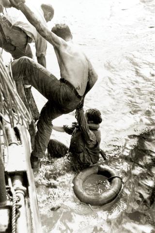 26 October 1944: American survivors of the Battle off Samar are brought aboard a U.S. Navy ship. Some 1,200 survivors from the USS Gambier Bay (CVE-73), Hoel, Johnston, and Samuel B. Roberts (DE-413) will be rescued during the days following the action. 