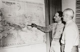“Overlapping yet conflicting objectives”: Admiral Chester W. Nimitz and General Douglas MacArthur discuss Pacific war strategy at General MacArthur’s headquarters, Brisbane, Australia, 27 March 1944. 