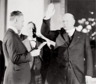 With the retirement of Josephus Daniels (center), Edwin Denby (right) takes the oath of office as 42nd Secretary of the Navy on 6 March 1921. He was an out-of-left-field selection, and the ostensible dream job “would prove more a nightmare for him, personally and professionally.”