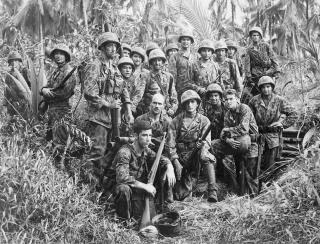 U.S. Marine Raiders gathered in front of a Japanese dugout on Cape Torokina on Bougainville, Solomon Islands, in January 1944.