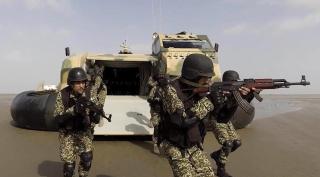 Pakistan Marines disembark from a Griffon Hovercraft 