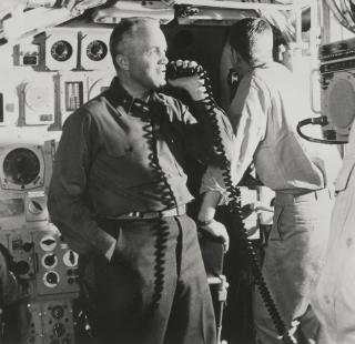 Captain Ned Beach informing his crew on board the USS Triton (SSRN-586) in 1960, ten days into a patrol from Groton, Connecticut, that the Triton was on her way to make the first submerged circumnavigation of the globe. Beach had served as President Dwight D. Eisenhower’s naval aide and published the novel Run Silent, Run Deep in 1955.