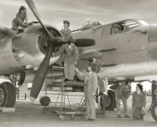 Top: An all-woman Marine crew puts the finishing touches on a PBJ medium bomber. During World War II, the Marine Corps Women’s Reserve took on such jobs to free men for fighting. 