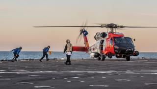 A Coast Guard MH-60T Jayhawk lands on the dock landing ship USS Comstock (LSD-45) during a 2019 exercise. “In an age dominated by blood and belief,” Admiral Sandy Winnefeld wrote in 2008, the nation needs “more robust Navy, Marine Corps, and Coast Guard forces.”
