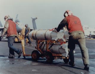 Navy munitions specialists transport Rockeye II Mk 20 bombs 