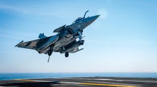 A French Navy Rafale jet lands on the USS George H. W. Bush (CVN-77) 