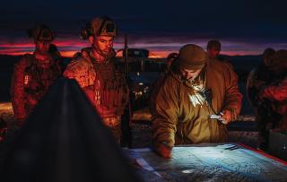 Marines from 2d Battalion, 6th Marine Regiment, plan a training assault in February 2024. Line infantry might attempt to reach the limit of advance and destroy the opponent. In contrast, a light infantry company would avoid direct engagement, probably conducting night attacks from multiple directions to employ mass surprise fires to destroy the enemy. 