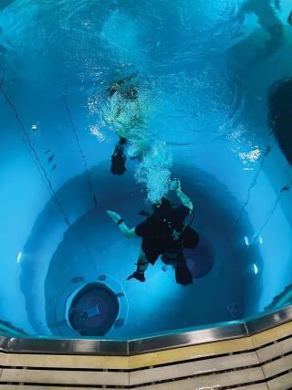 Sailors train in the submarine escape trainer at Naval Submarine Base New London. Establishing a midcareer threshold for sailors to revisit a submarine pressurized escape trainer would allow them to build on the ascension training they learned at the Basic Enlisted Submarine School.