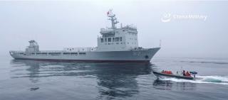 A rigid-hull inflatable boat approaches the training ship Shichang