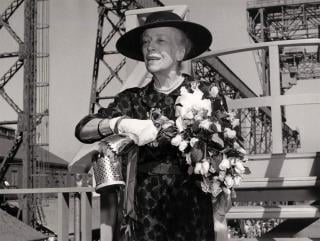 Alice Roosevelt, now Alice Roosevelt Longworth, christens the submarine named after her father. But it’s not as easy as one perhaps might think to break a champagne bottle on the bow of a massive steel vessel . . .