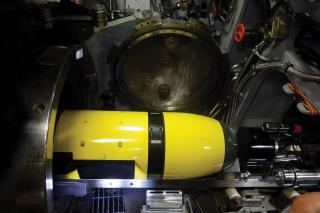 The Yellow Moray (REMUS 600) unmanned underwater vehicle (UUV) in the torpedo room on board the USS Delaware (SSN-791) during its recent deployment. UUVs allow submarines to extend their operational reach, find and fix objects of interest on the sea bottom, and perform security sweeps without putting divers in the water.