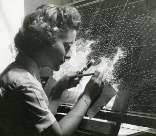 An enlisted WAVE works on a chart in the Navy Hydrographic Office  in 1944. By war’s end, 86,000 women were serving on active duty in the Navy.