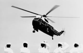 A U.S. Marine Corps VH-3A Sea King, with President Richard Nixon on board, prepares to touch down on the aircraft carrier Saratoga (CVA-60).