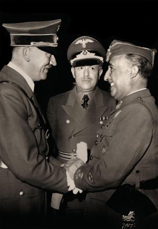 Francisco Franco (right), having emerged victoriously as the military dictator of Spain after three bitter years of internecine warfare, beams as he greets Adolf Hitler in the Pyrenees in October 1940. Nazi Germany had provided air power, troops, and naval support—pocket battleships, a light cruiser, torpedo boats, and U-boats—to Franco’s war effort, and now Hitler wanted to cut a deal, bringing Spain into the Axis. (Franco’s demands in return were such that Hitler balked.)
