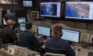 Sailors in a ship’s combat information center 
