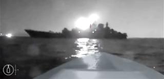 A screenshot from a Ukrainian video shows a Sea Baby USV approaching a Russian warship.
