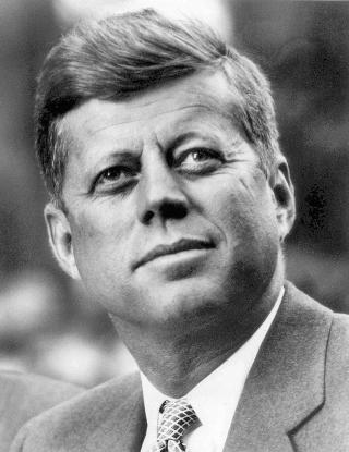 President John F. Kennedy looking up