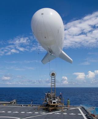 An aerostat is tethered for the first time to the USNS Spearhead (JHSV-1) 