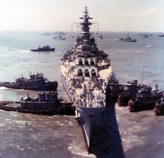 Harbor tugs attempt unsuccessfully to free the USS Missouri (BB-63)