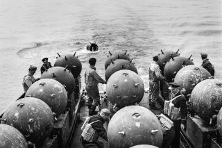 Sailors on board the Finnish Navy minelayer Ruotsinsalmi lay sea mines to protect against Soviet submarines in the Southern Finnish Archipelago on 18 May 1942. As part of joint campaigning during World War II, the Germans perfected strategic minelaying, including cooperative mining with Finland—which had sided with Germany—in the Gulf of Finland.