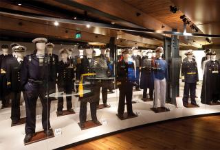 The museum also offers visitors a glimpse into the lives of the sailors who manned the myriad ships they see modeled. Uniforms, hats, medals, small arms, and more are all on display on the fourth deck. 