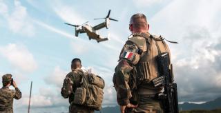 French Marines observe an MV-22B Osprey at Marine Corps Base Hawaii in July 2023. After a November accident involving a U.S. Air Force CV-22B that was suspected to have been caused by a material failure, the entire Department of Defense Osprey fleet was grounded.