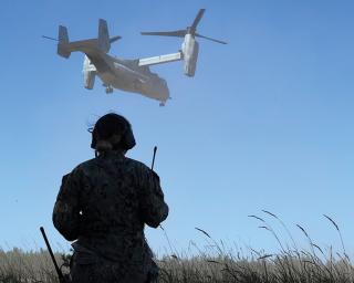 Air Controller Second Class Tabitha Cary controls a Marine Corps MV-22 Osprey