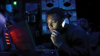 An air intercept controller on board the USS Kearsarge (LHD-3).