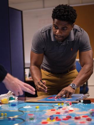 Students and instructors practice complex war strategies at the Naval War College. 