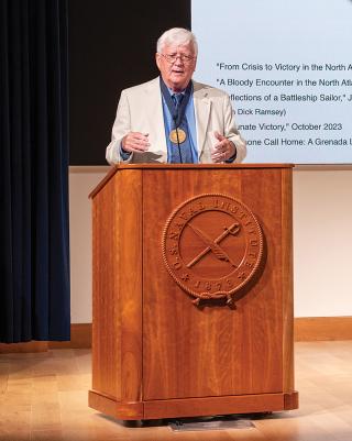 Ed Offley addresses the audience at the U.S. Naval Institute’s Annual Meeting after receiving the Naval History Author of the  Year medal.