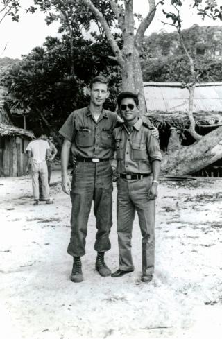 Then-Lieutenant Swartz and Ensign Nghiep, an ex-enlisted Vietnamese officer, on an island in the Gulf of Thailand