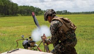 A Marine launches a Switchblade drone during a training exercise. MarSOC experimentation and development of organic ground precision strike and other capabilities help refine infantry battalions across the Marine Corps in accordance with Force Design.