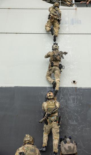 Marine Raiders conduct visit, board, search, and seizure training. Every Marine Raider first served in the conventional force and maintains bonds and relationships that can aid collaboration.